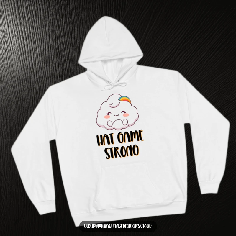 Funny hoodie featuring a cute cloud animal character sporting a rainbow hat and waving enthusiastically, ready to greet.