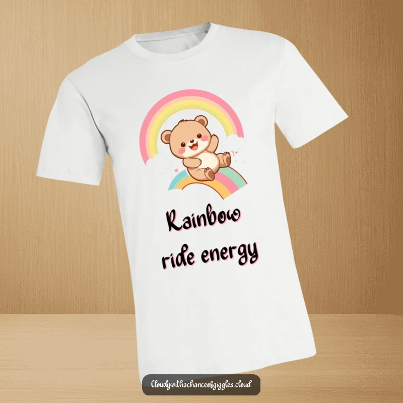 Funny bear cub sliding down a colorful rainbow with a huge grin, depicted on a t-shirt, embodying pure playful joy and excitement.