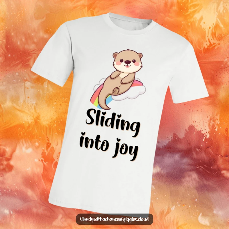 A funny, playful otter joyfully slides down a vibrant rainbow from a soft cloud, illustrated on this amusing t-shirt.