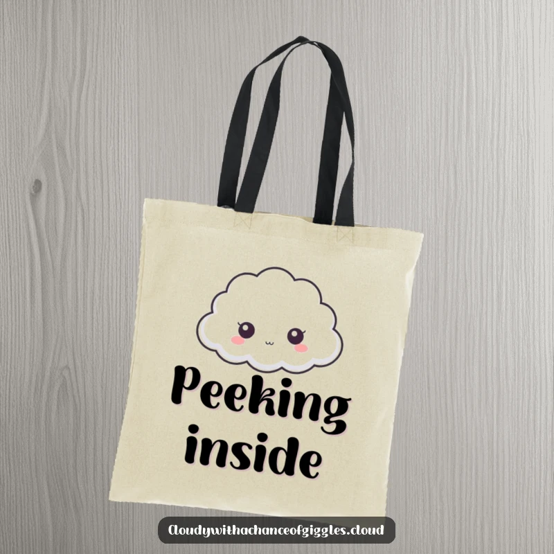 Funny cloud tote bag, a tiny cloud with big eyes peeking from behind a larger cloud, adding a playful touch.